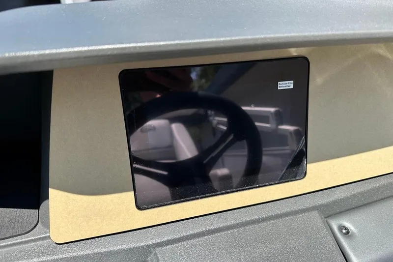 Slide: The Image of Dashboard of 2026 Sun Tracker Party Barge 20 DLX with protective film on display. - 22