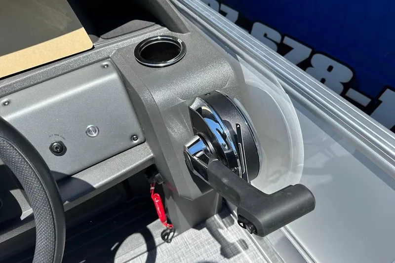 Slide: The Image of 2026 Sun Tracker Party Barge 20 DLX throttle control and dashboard detail. - 23