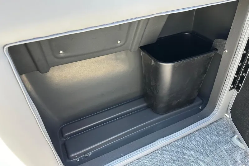 Slide: The Image of Storage compartment with trash bin in 2026 Sun Tracker Party Barge 20 DLX. - 26