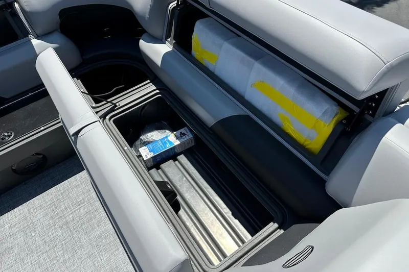 Slide: The Image of Interior storage of 2026 Sun Tracker Party Barge 20 DLX with open compartments. - 28