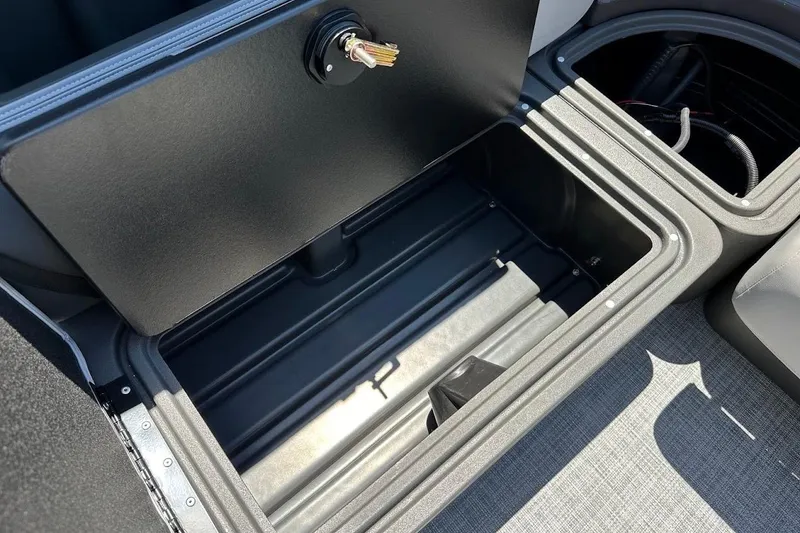 Slide: The Image of 2026 Sun Tracker Party Barge 20 DLX storage compartment with key lock. - 31