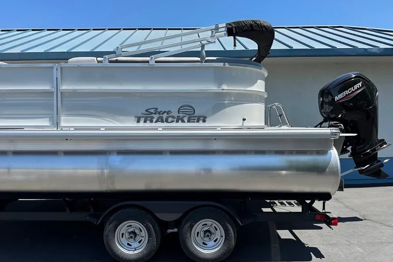 Slide: The Image of 2026 Sun Tracker Party Barge 20 DLX pontoon boat with Mercury outboard motor. - 6