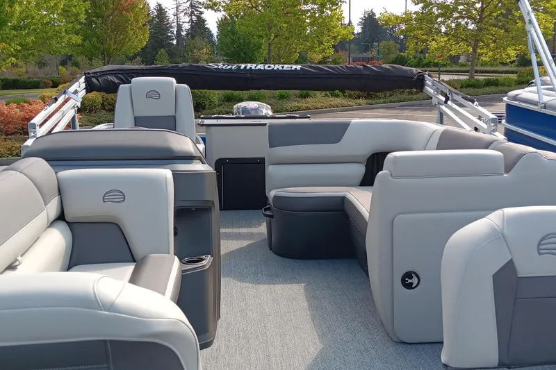 Slide: The Image of 2026 Sun Tracker Fishin' Barge 20 DLX interior with spacious seating and modern design. - 3