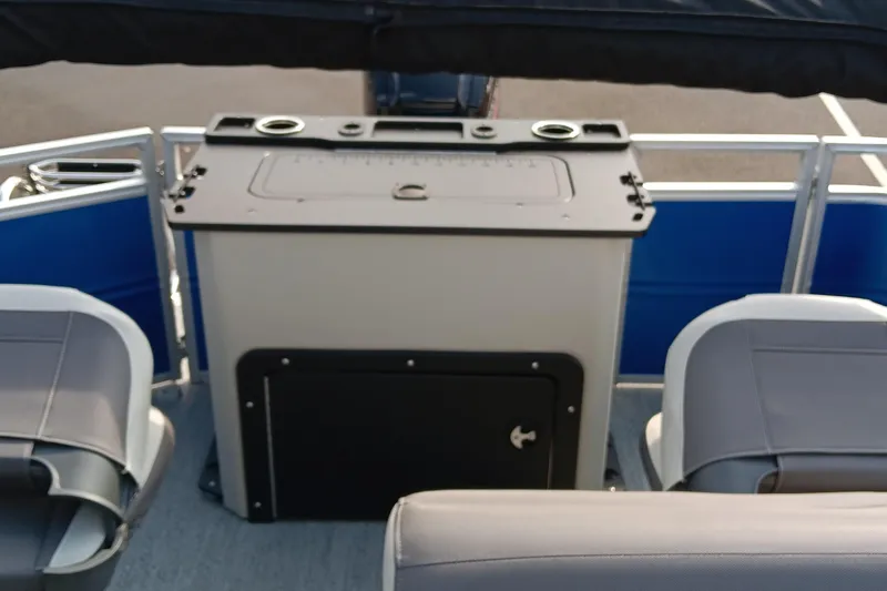 Slide: The Image of 2026 Sun Tracker Fishin' Barge 20 DLX interior with seating and storage area. - 5