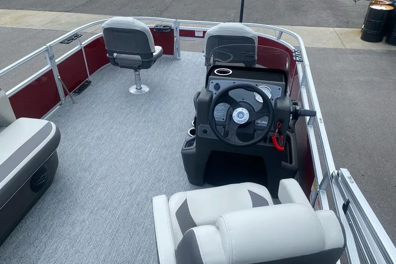 Slide: The Image of 2026 Sun Tracker Bass Buggy 16 XL Select pontoon boat interior with steering console. - 8