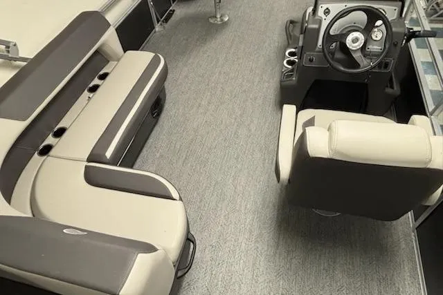 Slide: The Image of 2026 Sun Tracker Bass Buggy 18 DLX interior with seating and steering console. - 3