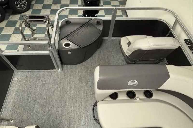 Slide: The Image of 2026 Sun Tracker Bass Buggy 18 DLX interior with seating and storage compartments. - 4