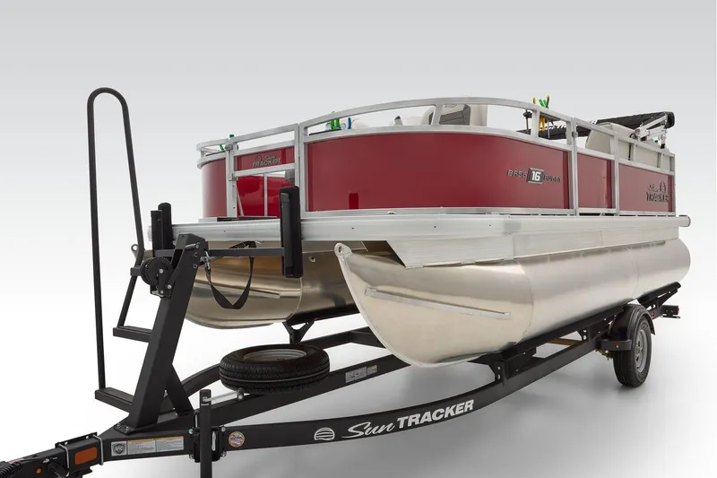 Slide: The Image of 2026 Sun Tracker Bass Buggy 16 XL Select pontoon boat interior with seating and steering wheel. - 14