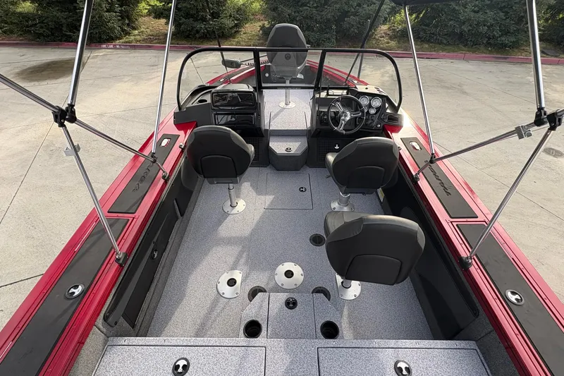 Slide: The Image of 2026 Tracker Targa V-19 Combo boat interior with seating and steering console. - 59