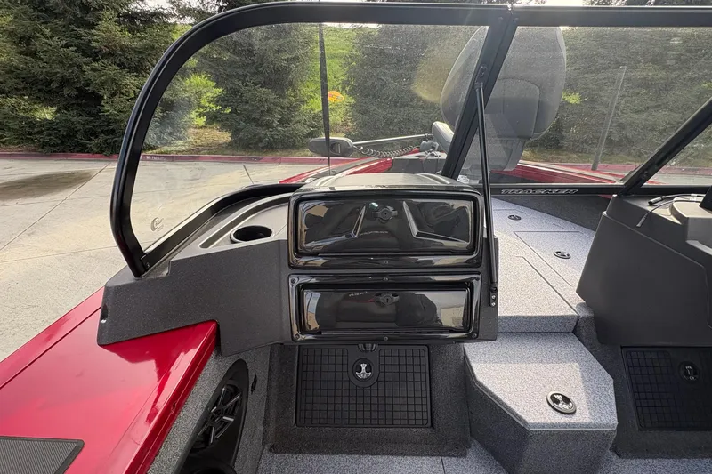 Slide: The Image of 2026 Tracker Targa V-19 Combo boat interior with windshield and dashboard view. - 61