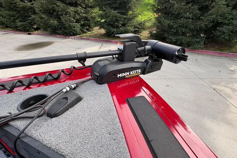 Slide: The Image of 2026 Tracker Targa V-19 Combo with Minn Kota PowerDrive trolling motor on red deck. - 63