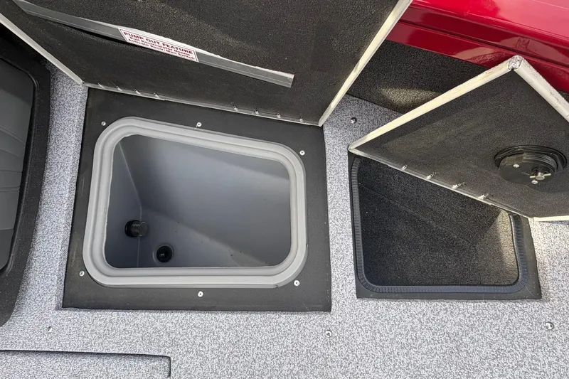 Slide: The Image of 2026 Tracker Targa V-19 Combo boat storage compartments with open lids. - 70