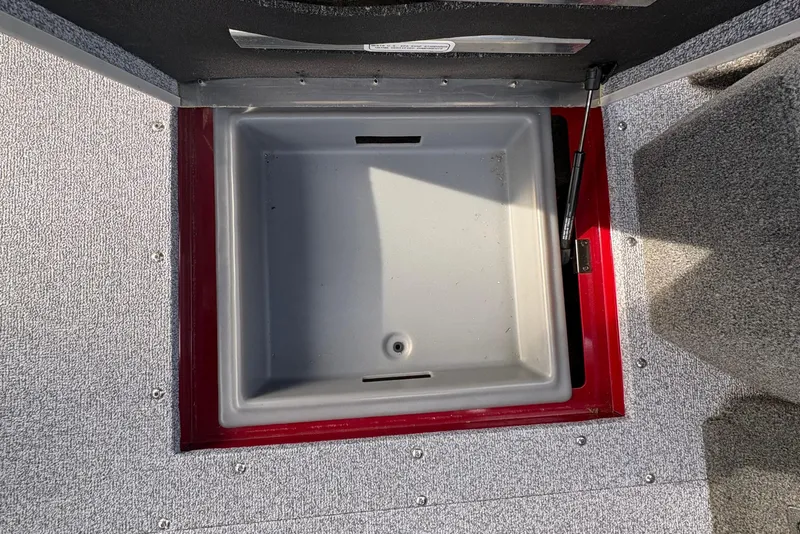 Slide: The Image of Open storage compartment in 2026 Tracker Targa V-19 Combo boat. - 75