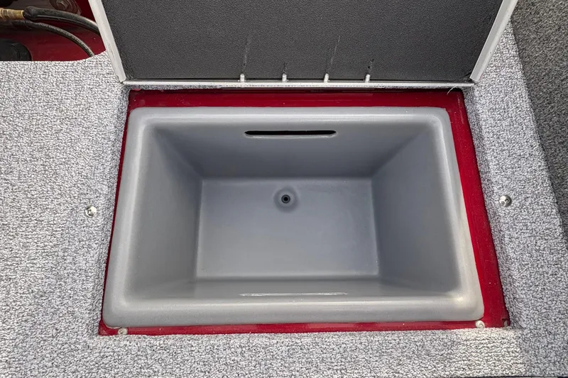 Slide: The Image of Open storage compartment in 2026 Tracker Targa V-19 Combo boat. - 78