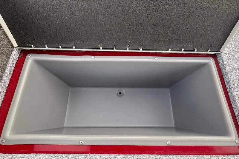 Slide: The Image of Storage compartment of 2026 Tracker Targa V-19 Combo boat, open and empty. - 79