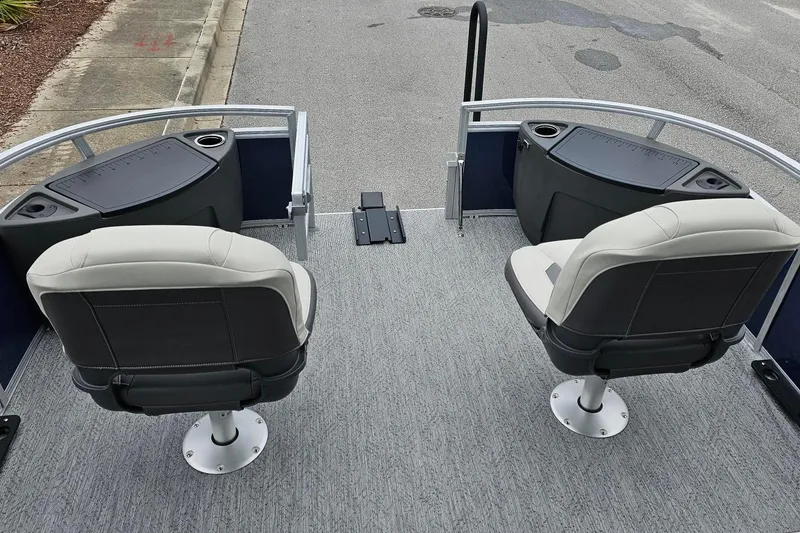 Slide: The Image of 2026 Sun Tracker Bass Buggy 18 DLX boat interior with two swivel seats and fishing stations. - 12