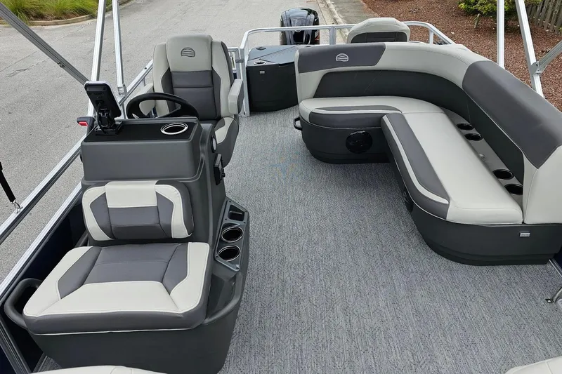 Slide: The Image of 2026 Sun Tracker Bass Buggy 18 DLX pontoon boat on trailer, rear view. - 13