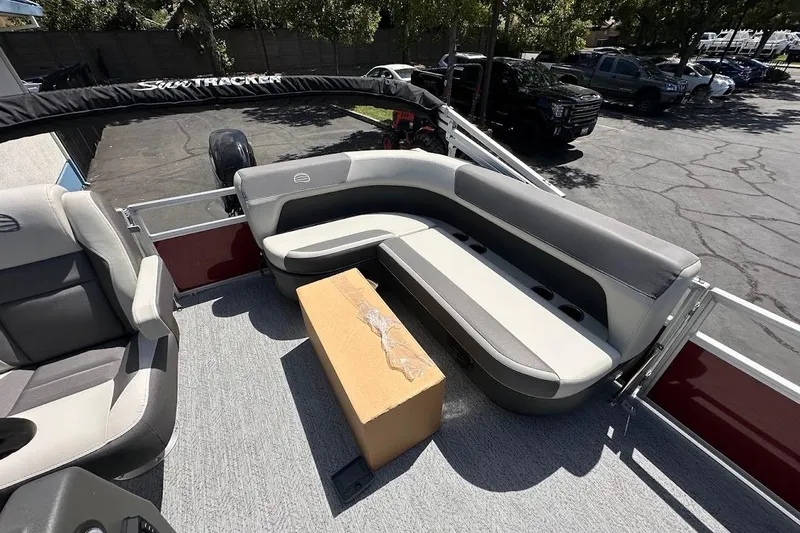 Slide: The Image of 2026 Sun Tracker Bass Buggy 16 XL Select pontoon boat interior with seating and storage. - 12
