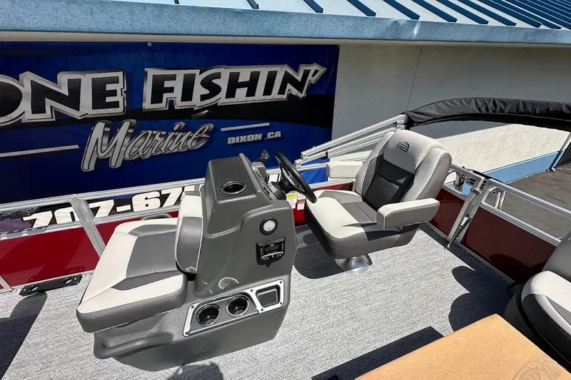 Slide: The Image of 2026 Sun Tracker Bass Buggy 16 XL Select boat interior with steering console and seating. - 13