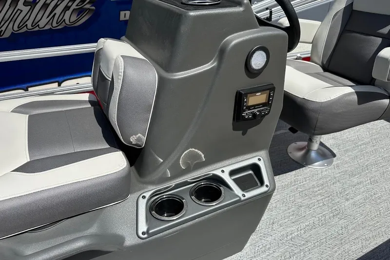 Slide: The Image of 2026 Sun Tracker Bass Buggy 16 XL Select interior with gray seating and control panel. - 18