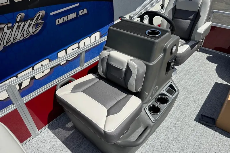 Slide: The Image of 2026 Sun Tracker Bass Buggy 16 XL Select boat interior with seating and steering console. - 20