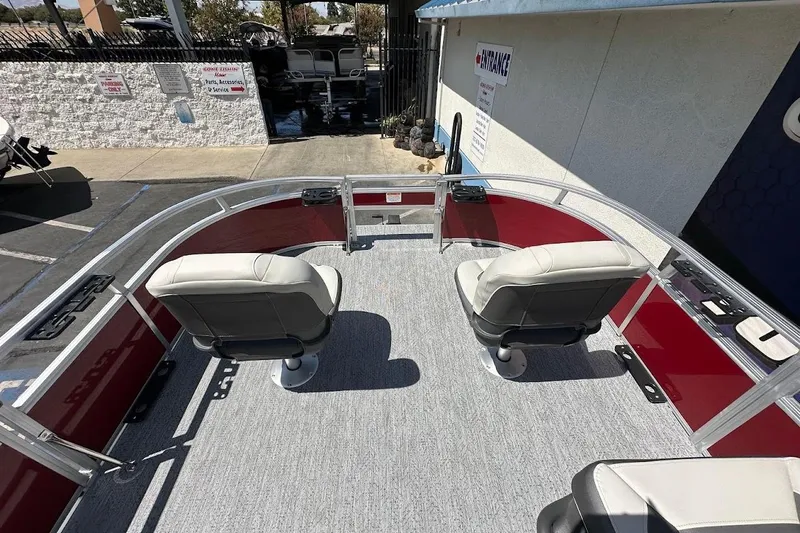 Slide: The Image of 2026 Sun Tracker Bass Buggy 16 XL Select pontoon boat interior with two swivel seats. - 22