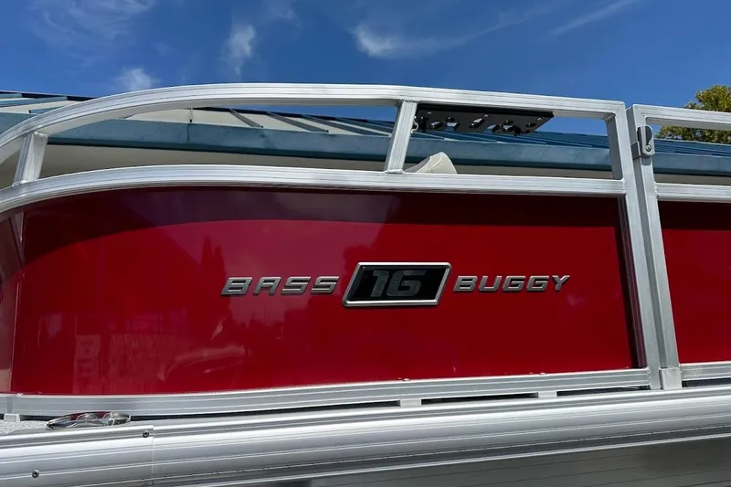 Slide: The Image of 2026 Sun Tracker Bass Buggy 16 XL Select pontoon boat, red exterior detail. - 4