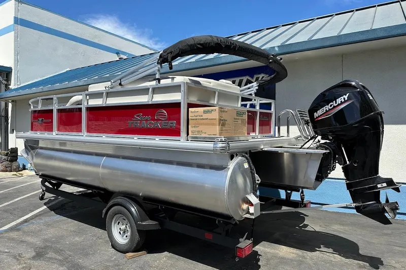 Slide: The Image of 2026 Sun Tracker Bass Buggy 16 XL Select pontoon boat with Mercury outboard motor. - 6