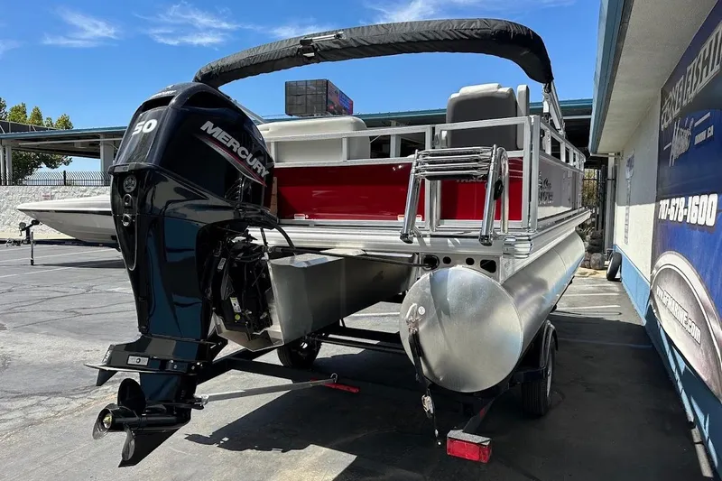 Slide: The Image of 2026 Sun Tracker Bass Buggy 16 XL Select pontoon boat with Mercury 50 engine. - 8