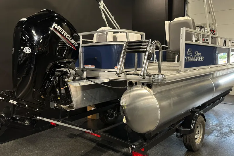 Slide: The Image of 2026 Sun Tracker Bass Buggy 18 DLX pontoon boat with Mercury outboard motor. - 15