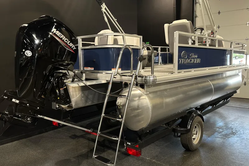 Slide: The Image of 2026 Sun Tracker Bass Buggy 18 DLX pontoon boat with Mercury outboard motor. - 16