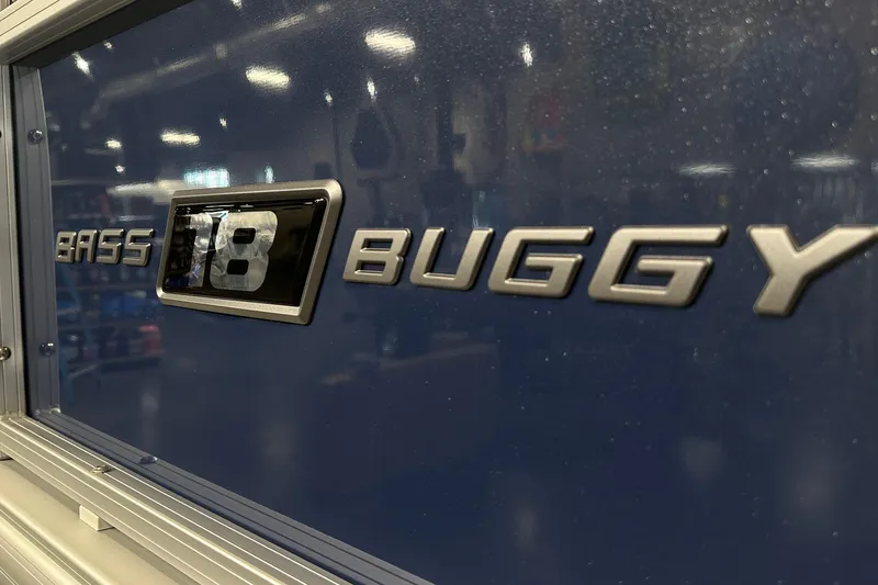 Slide: The Image of 2026 Sun Tracker Bass Buggy 18 DLX logo on blue background. - 20