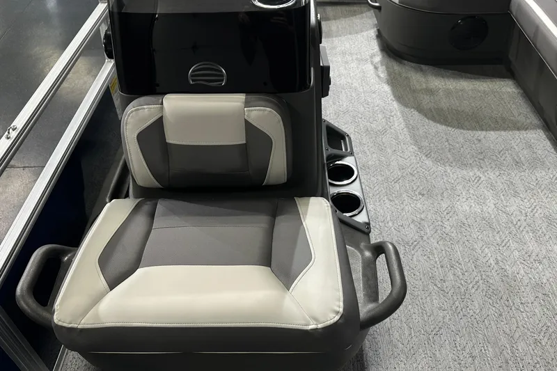 Slide: The Image of 2026 Sun Tracker Bass Buggy 18 DLX boat seat with cup holders and modern design. - 25