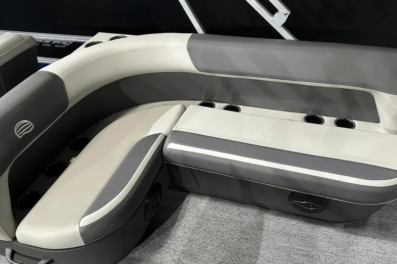 Slide: The Image of 2026 Sun Tracker Bass Buggy 18 DLX boat seating with cup holders, gray and white upholstery. - 27