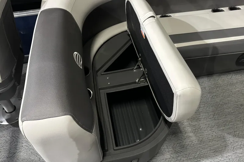 Slide: The Image of 2026 Sun Tracker Bass Buggy 18 DLX boat seat with open storage compartment. - 29