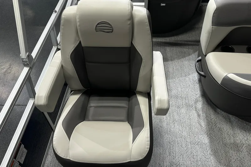 Slide: The Image of 2026 Sun Tracker Bass Buggy 18 DLX boat seat, featuring gray and beige upholstery. - 31