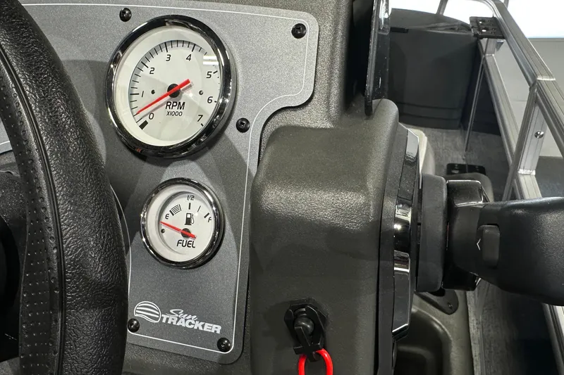 Slide: The Image of Dashboard of 2026 Sun Tracker Bass Buggy 18 DLX with RPM and fuel gauges. - 34