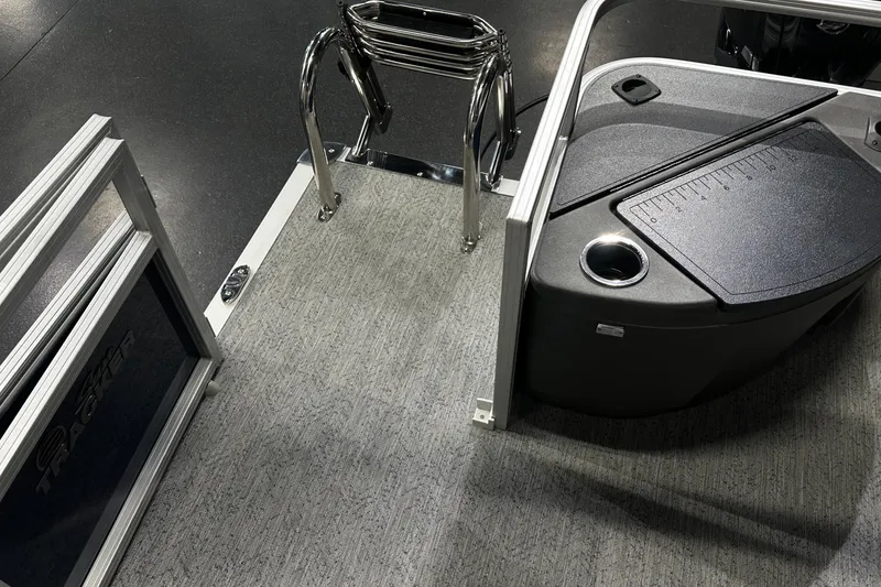 Slide: The Image of 2026 Sun Tracker Bass Buggy 18 DLX boat interior with seating and storage features. - 38