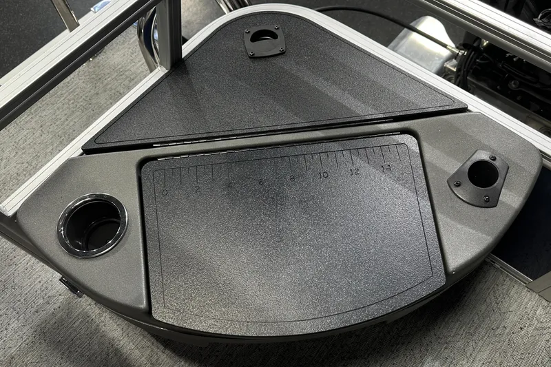 Slide: The Image of 2026 Sun Tracker Bass Buggy 18 DLX boat deck with cup holder and measurement markings. - 39