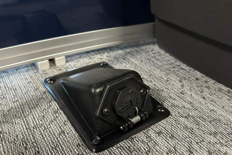 Slide: The Image of 2026 Sun Tracker Bass Buggy 18 DLX boat detail, featuring a black deck fitting. - 43