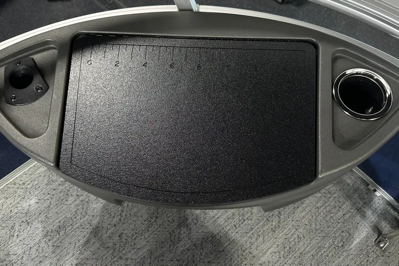 Slide: The Image of Control panel of 2026 Sun Tracker Bass Buggy 18 DLX with cup holder and ruler. - 46