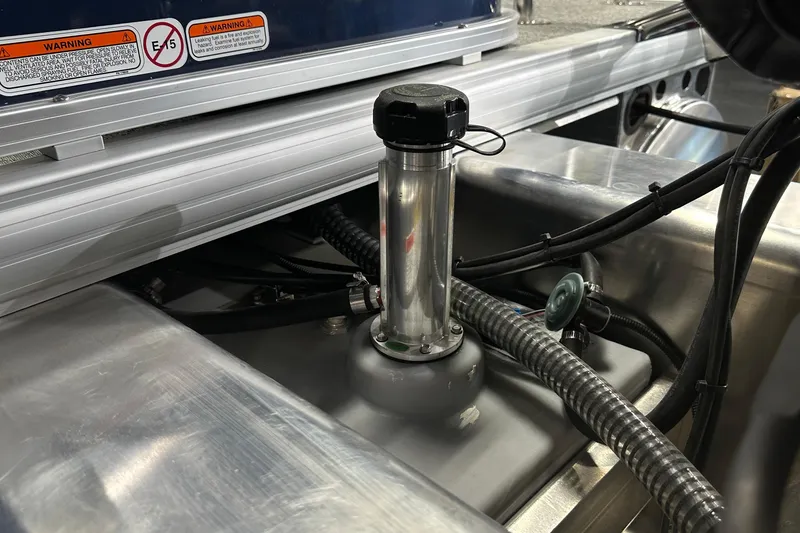 Slide: The Image of Fuel system of 2026 Sun Tracker Bass Buggy 18 DLX with visible hoses and warning labels. - 50