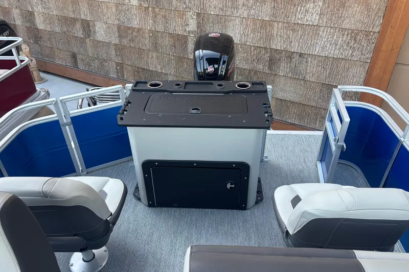 Slide: The Image of 2026 Sun Tracker Fishin' Barge 20 DLX interior with seating and control console. - 9