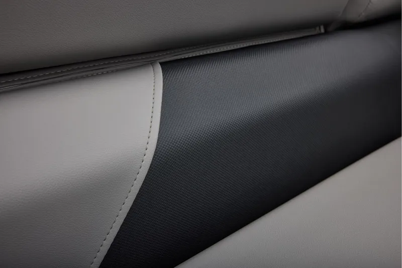 Slide: The Image of 2026 Sun Tracker SportFish 20 DLX boat interior with open storage compartment and cushioned seating. - 29