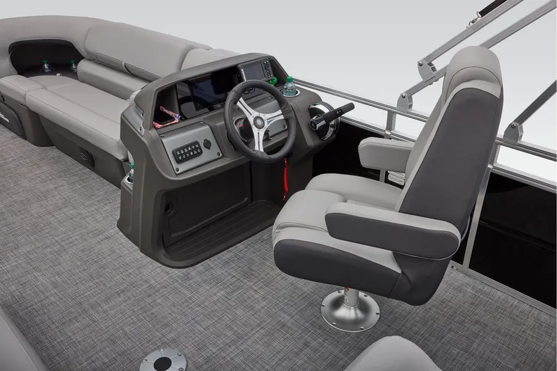 Slide: The Image of 2026 Sun Tracker SportFish 20 DLX dashboard with steering wheel and control panel. - 34