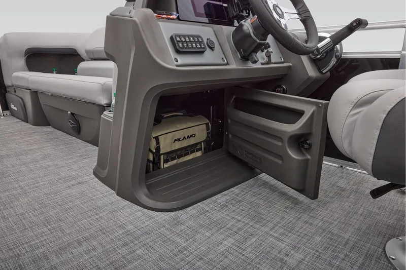 Slide: The Image of 2026 Sun Tracker SportFish 20 DLX dashboard with steering wheel and digital display. - 36