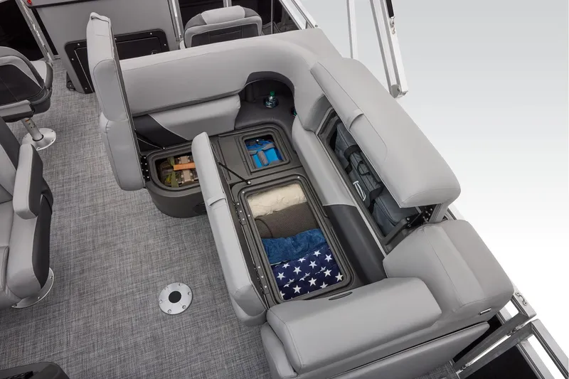 Slide: The Image of 2026 Sun Tracker SportFish 20 DLX boat interior with seating and storage area. - 48