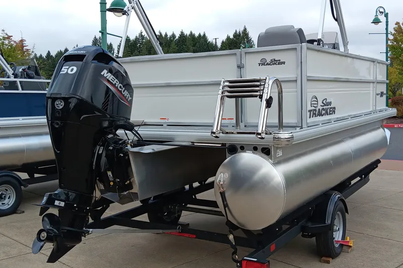Slide: The Image of 2026 Sun Tracker Party Barge 16 DLX pontoon boat with Mercury 50 engine on trailer. - 4