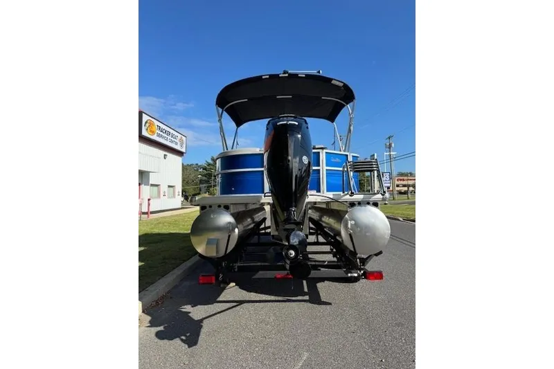 Slide: The Image of 2026 Sun Tracker Party Barge 20 DLX pontoon boat at service center. - 3