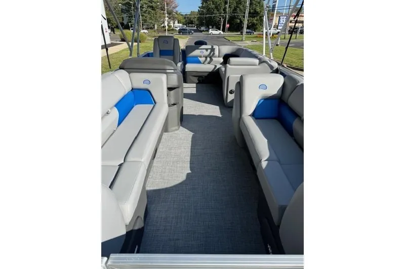 Slide: The Image of 2026 Sun Tracker Party Barge 20 DLX interior with gray and blue seating. - 8